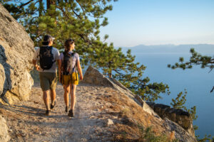 A couple hiking the trails surrounding Lake Tahoe